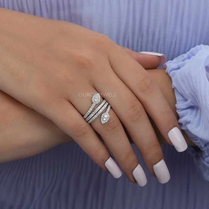 In finger side view of Round Diamond Cluster Ring in 14k white gold.