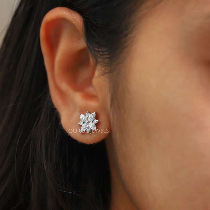 Marquise Cut Cluster Stud Earrings shown worn on an ear, showcasing the intricate floral design and brilliance of the lab-grown diamonds against the skin.