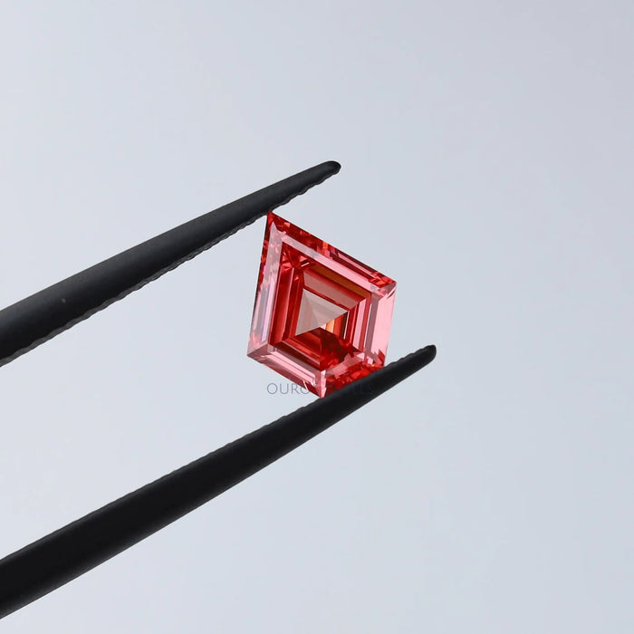 fancy pink kite shaped diamond lab grown loose held with tweezer