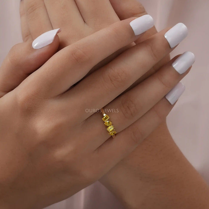 In finger slight front look of unique yellow gold engagement ring