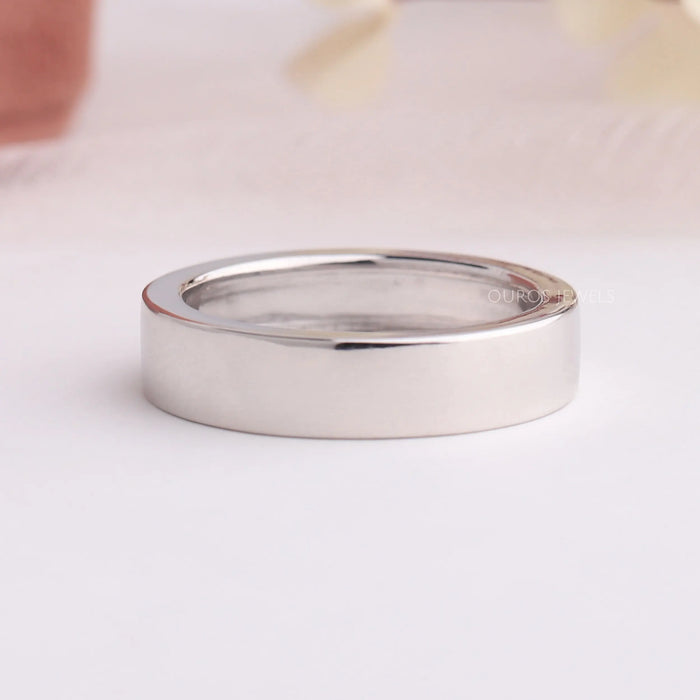 back view solitaire round shaped diamond flush set men's platinum wedding band