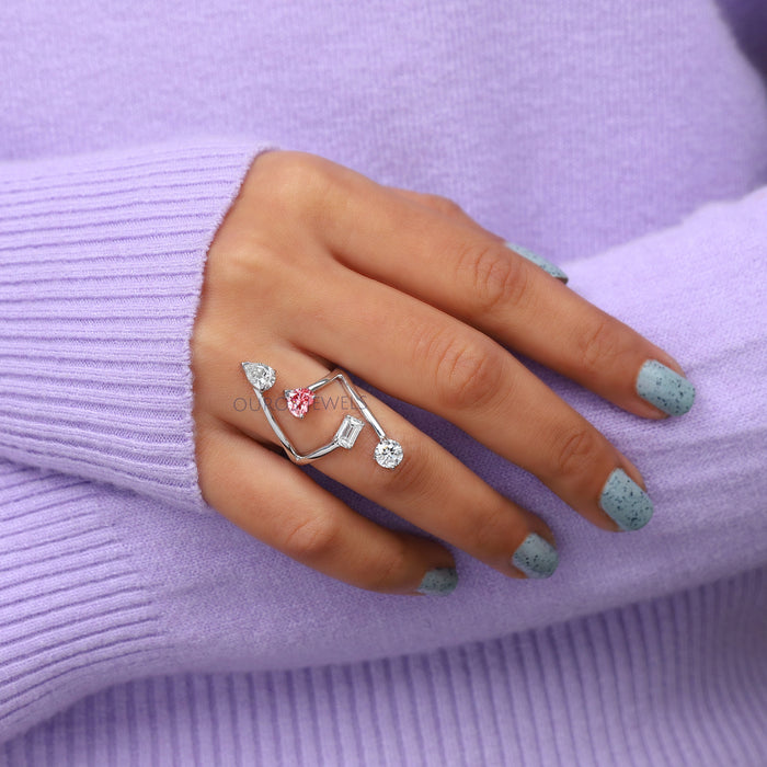 multi shape diamond bypass engagement ring white gold on model's finger