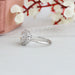 old european round cut diamond halo solitaire ring white gold on model's finger