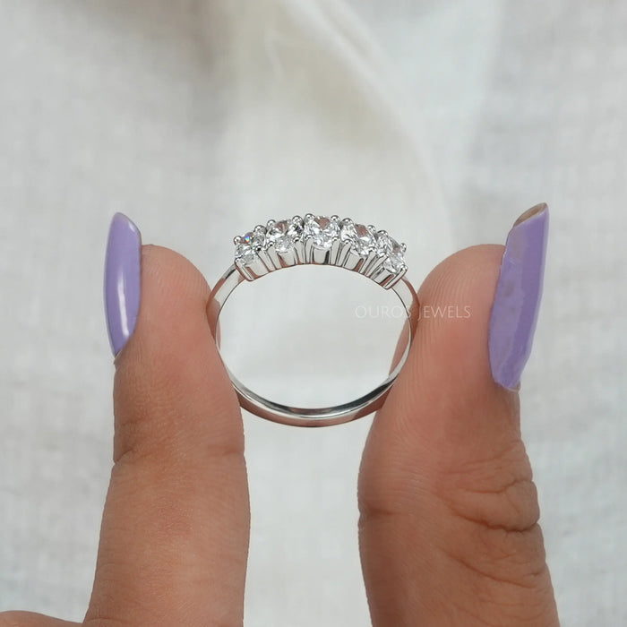 close view of oval cut lab grown diamond five stone wedding ring