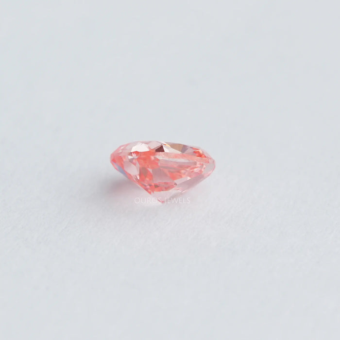 side view of 0.6 carat pink lab grown cushion cut diamond