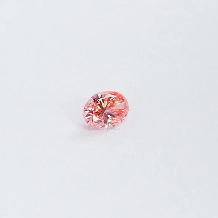 side view of 0.6 carat pink oval cut lab grown diamond loose
