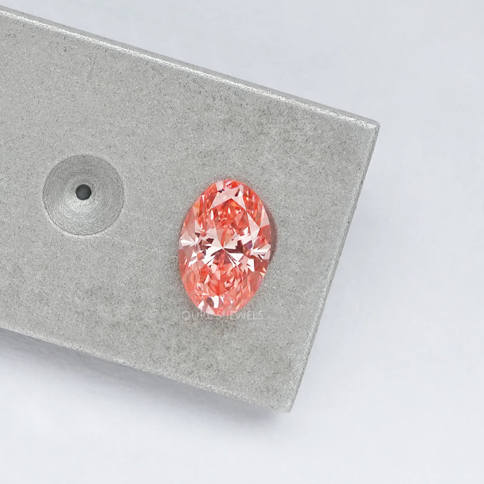 0.6 carat pink oval cut lab made diamond loose on matte material
