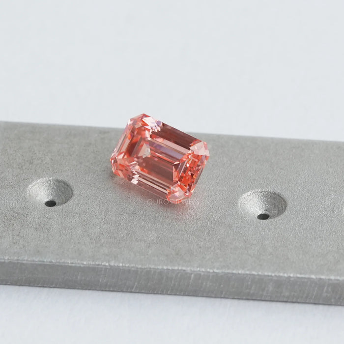 pink emerald cut man made diamond loose on matte material