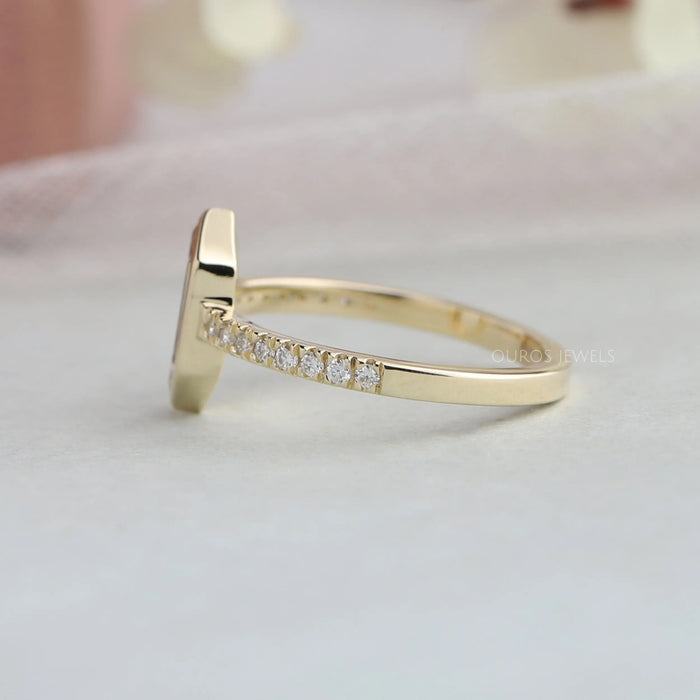 side view of hexagon long portrait cut diamond bezel set solitaire wedding ring