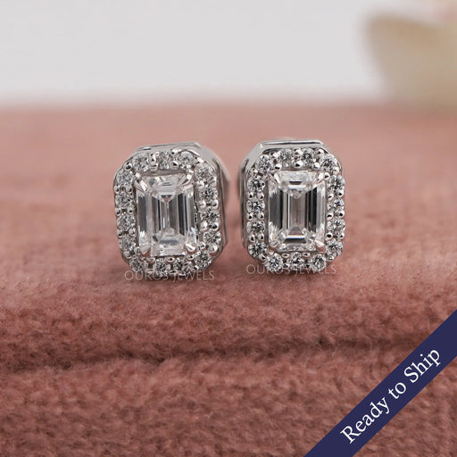 Front view of Emerald Cut stud earring crafted with halo style setting with 4 prong set.