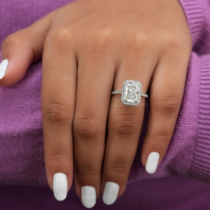 radiant cut lab diamond halo engagement ring white gold on model's finger