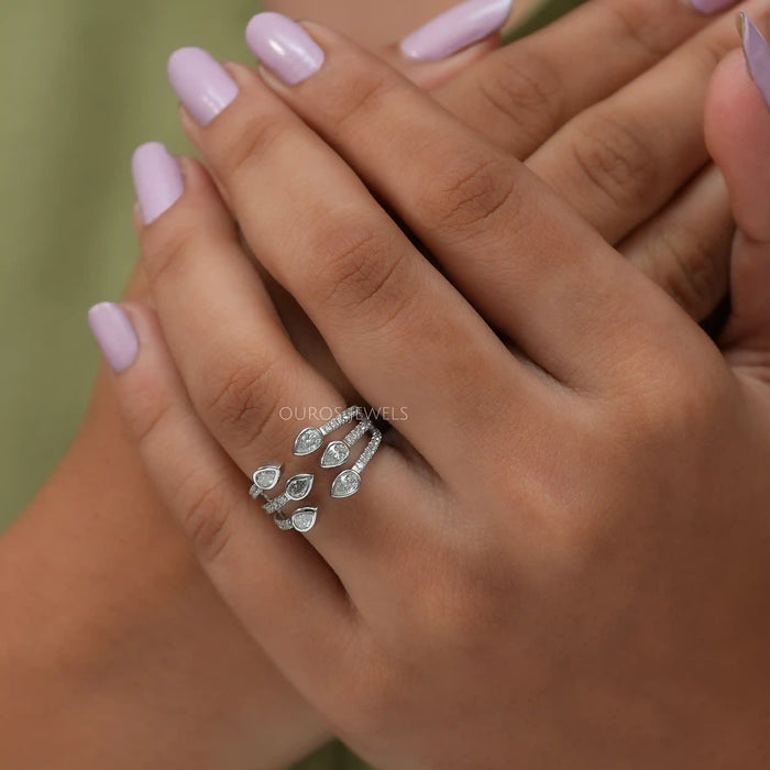 in finger front look of vintage pear cut lab made diamond engagement ring