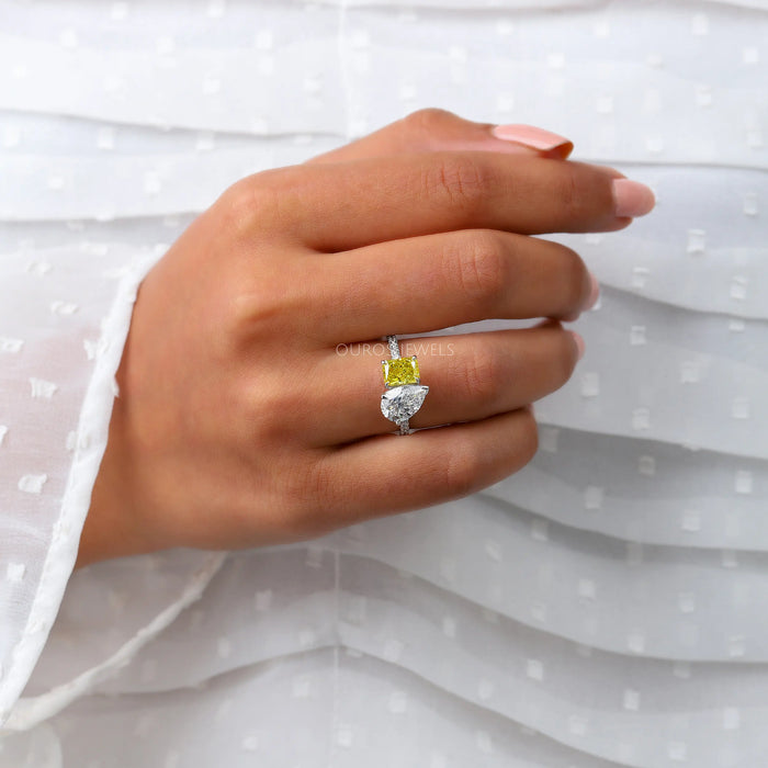 pear and yellow radiant-cut lab diamond toi et moi wedding ring in finger