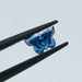 0.55 carat blue butterfly cut lab created diamond loose holded with tweezer