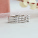 side view of round-cut diamond solitaire 3 bridal ring set with white gold band