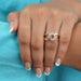 round cut lab diamond cuban link cluster engagement ring on model's finger