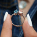 close view of blue marquise and pink pear lab diamond toi et moi engagement ring