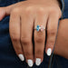 blue marquise and pink pear lab diamond toi et moi engagement ring in finger