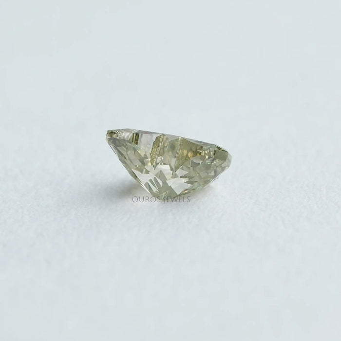 side view of green butterfly shaped man made diamond
