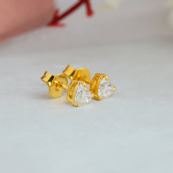 side view of heart shaped lab-grown diamond stud earrings gold