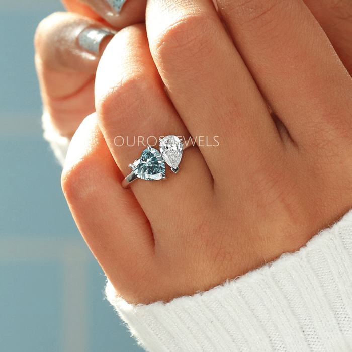 blue heart and pear-cut lab-grown diamond toi et moi wedding ring in finger