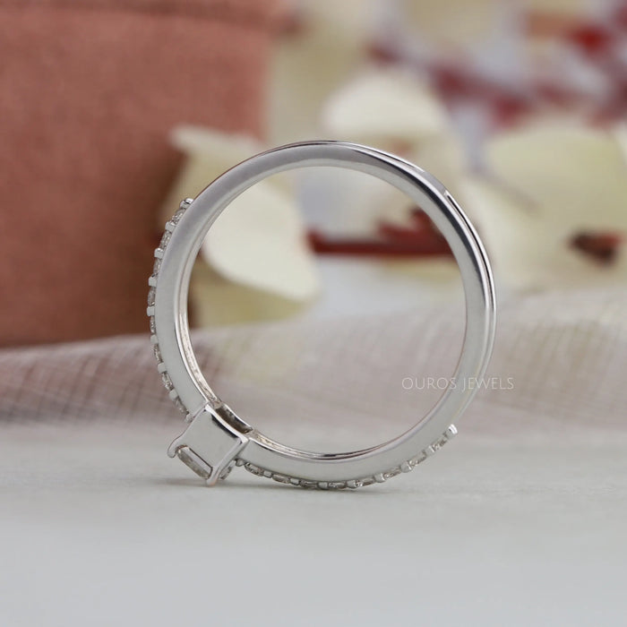 back fall view of olive emerald cut diamond solitaire accent ring with white gold band