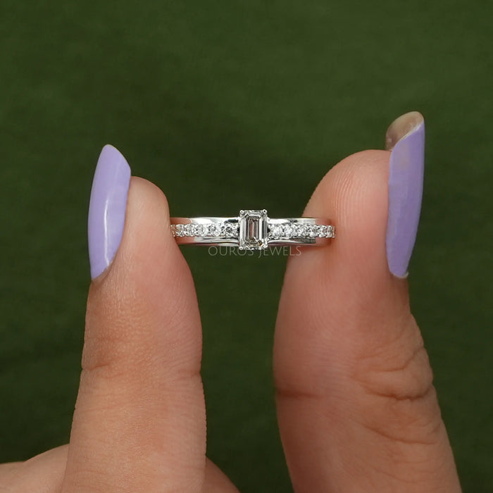 close view of olive emerald-cut diamond solitaire accent ring with white gold band