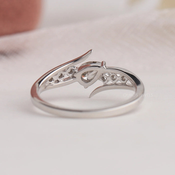 Back view of pear diamond ring with 14k white gold. This engagement ring set in bypass.
