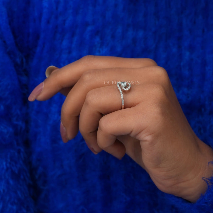 In finger side look of fancy green oval cut diamond wedding ring