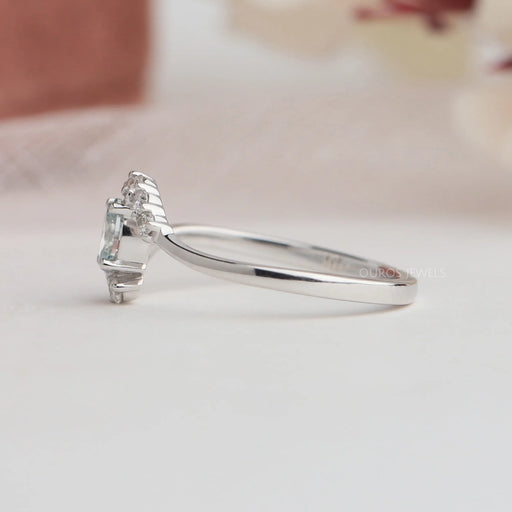 Side view of oval shaped diamond ring with curved band. This engagement ring crafted in 14k white gold & VS clarity. 