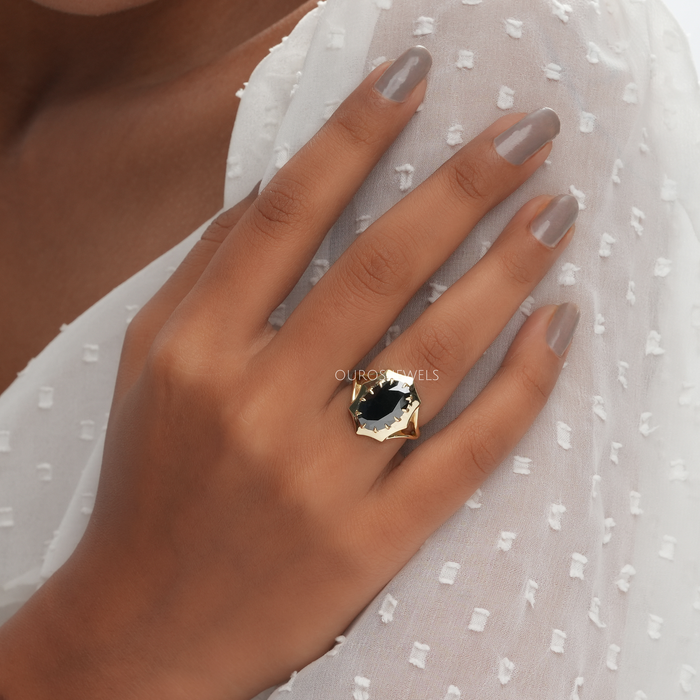 octagon shape oval-cut lab-grown diamond colored engagement ring in finger