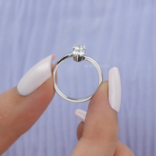 close view of pear and round cut lab diamond bypass wedding band