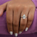 pear cut certified diamond solitaire engagement ring in model's finger