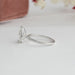 side view of pear cut certified diamond 3 prong engagement ring