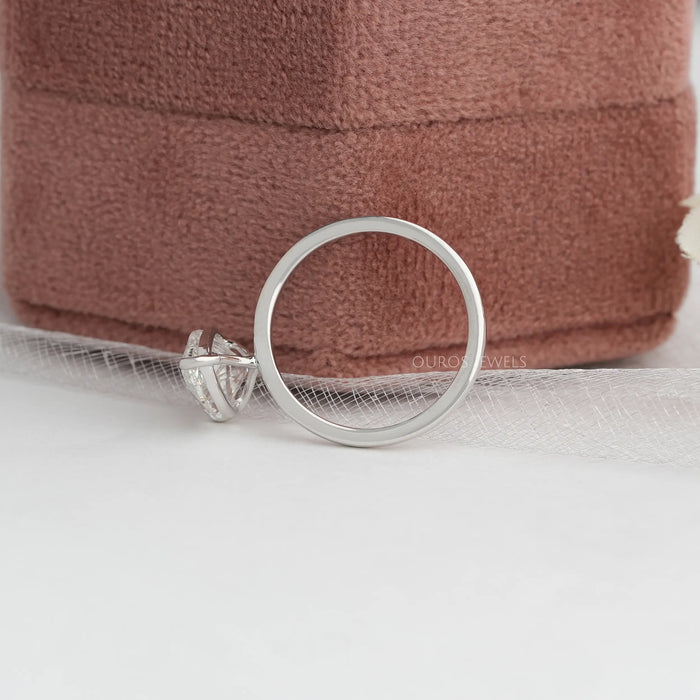 pear cut certified diamond engagement ring flatted on jewelry box