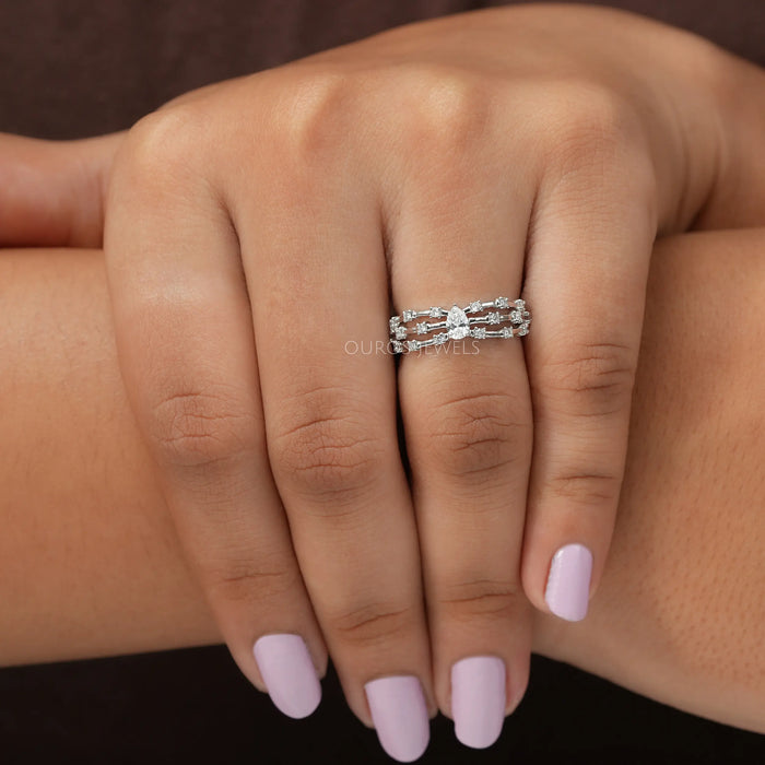 In finger look of unique pear cut lab created diamond engagement ring 