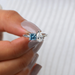 top view of blue princess-cut and pear lab diamond toi et moi wedding ring