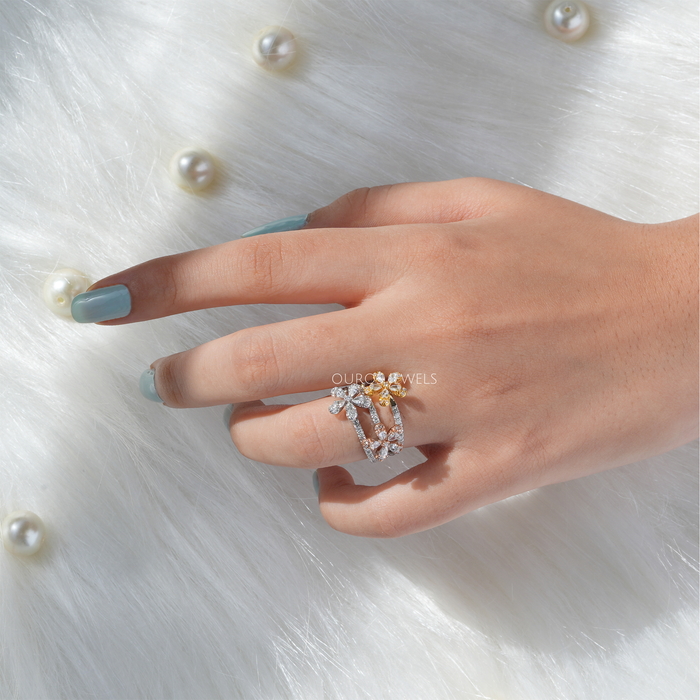 three flower-shaped pear-cut lab diamond bridal ring in finger