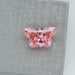 top view of 0.50 carat loose lab created pink diamond butterfly cut