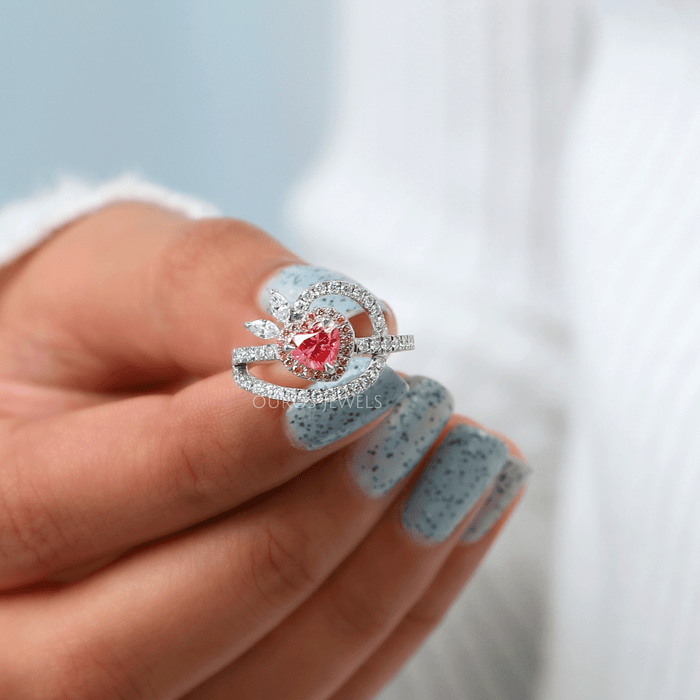 close view of pink heart-cut lab-grown diamond halo wedding ring