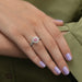 pink heart shaped diamond double halo engagement ring on model's finger