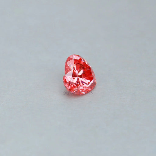 side view of pink heart cut lab made diamond