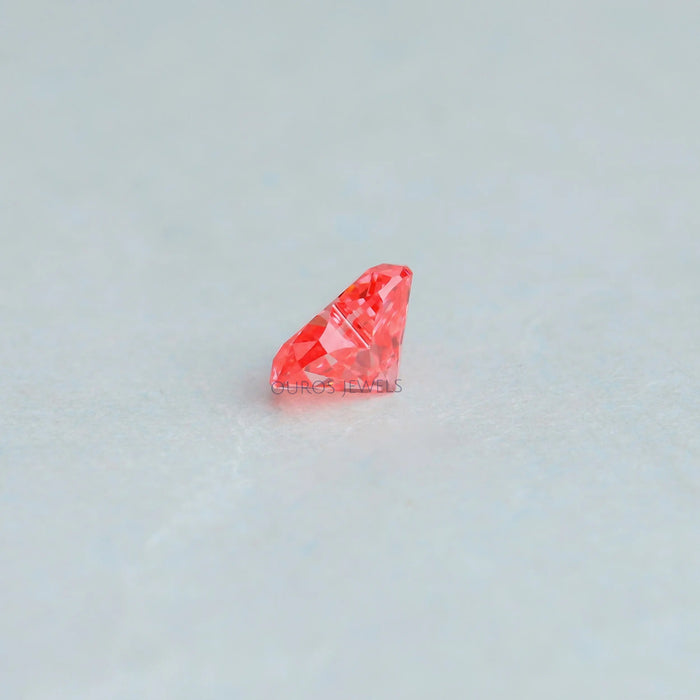 side view of pink heart shaped manufactured diamond 