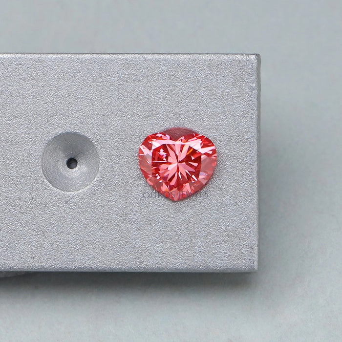 pink heart shaped man made lab diamond on matte grey material
