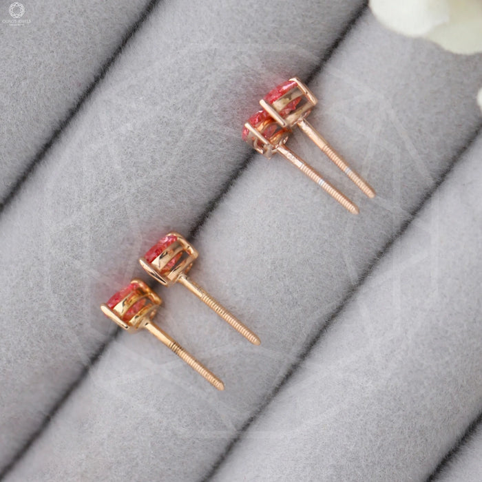 pink pear shaped diamond basket setting solitaire stud earrings rose gold