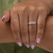 princess cut diamond five stone wedding ring with white gold band in finger
