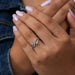 green princess-cut lab-grown diamond dainty wedding ring on model's finger