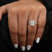 radiant cut diamond hidden halo solitaire engagement ring on model's finger