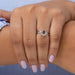 In finger front look of oval shaped infinity diamond ring, this ring crafted with 14k white gold.