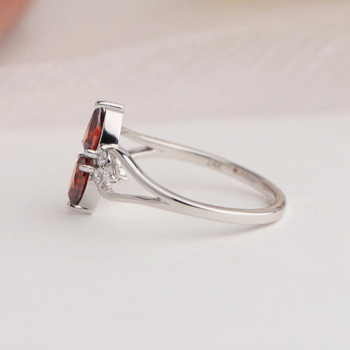 side view of red pear-cut lab diamond two-stone dainty colored wedding band